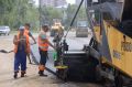 Дорожники приступили к укладке нижнего слоя асфальта на участке улицы Василенко между Институтской и Воронкова